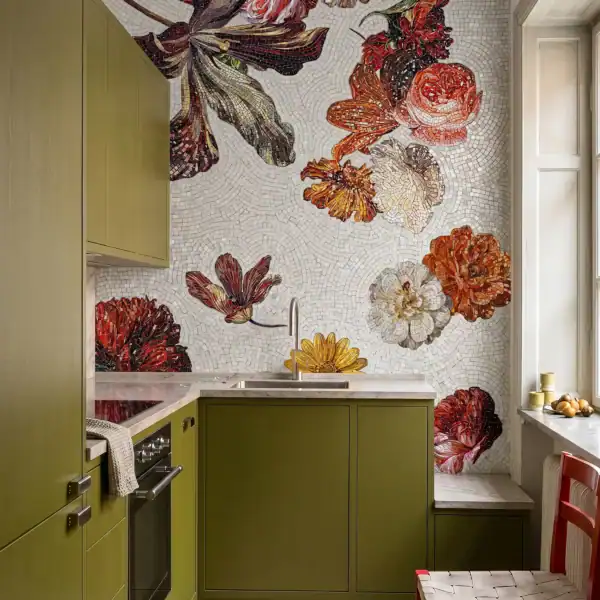Marigold Sonata floral mosaic backsplash featuring oversized marigold-inspired blooms in warm amber, ivory, and burgundy tones on an ivory mosaic background