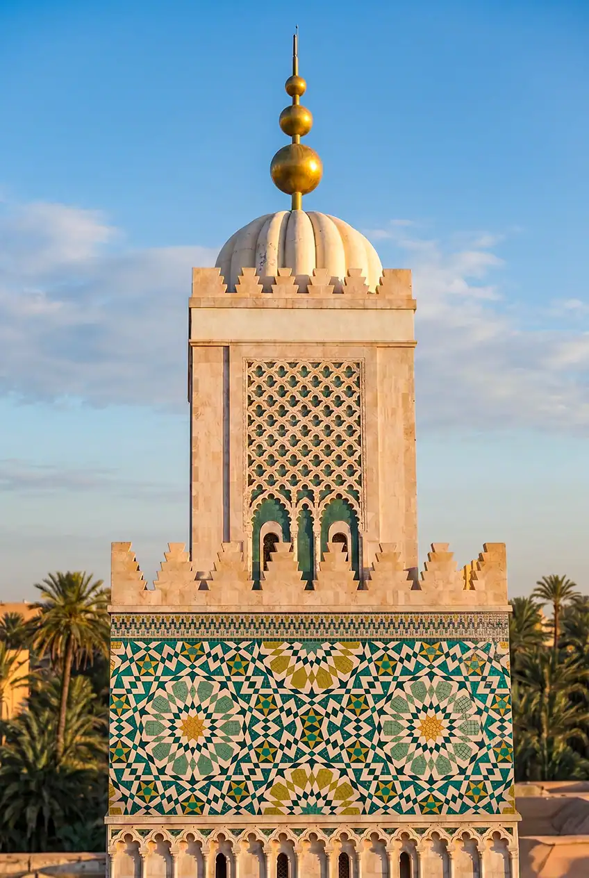 moroccan geometric mosaic tower featuring intricate islamic star patterns in turquoise gold and ivory architectural design