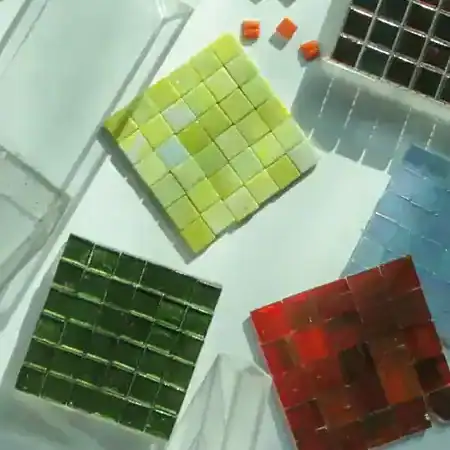 A multi color vibrant palette in square mosaics in red, dark green and light green colors.