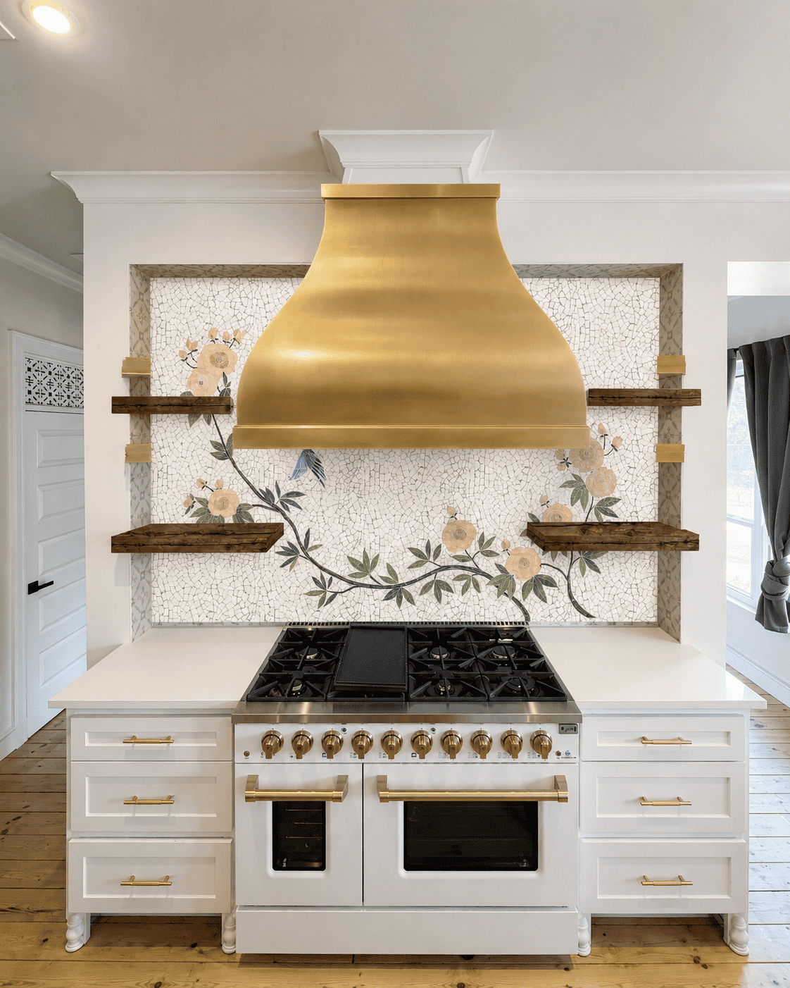 handcrafted botanical mosaic backsplash featuring cream flowers, green vines and a bluebird on a textured ivory mosaic background