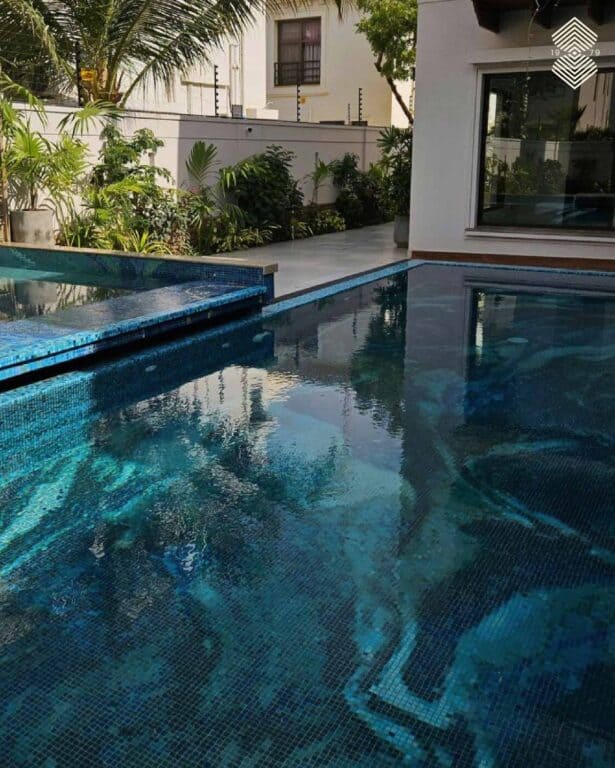 Complete view of a bespoke glass mosaic pool