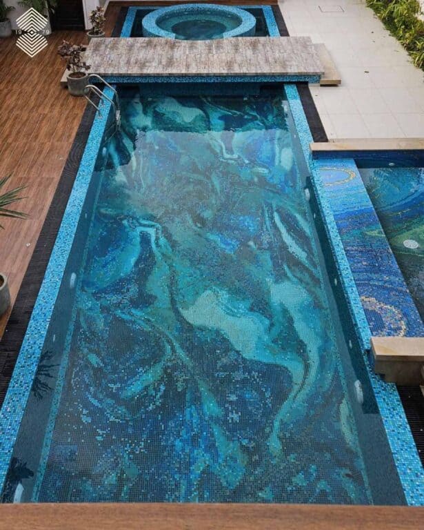 Contemporary residential pool finished with custom glass mosaic tesserae