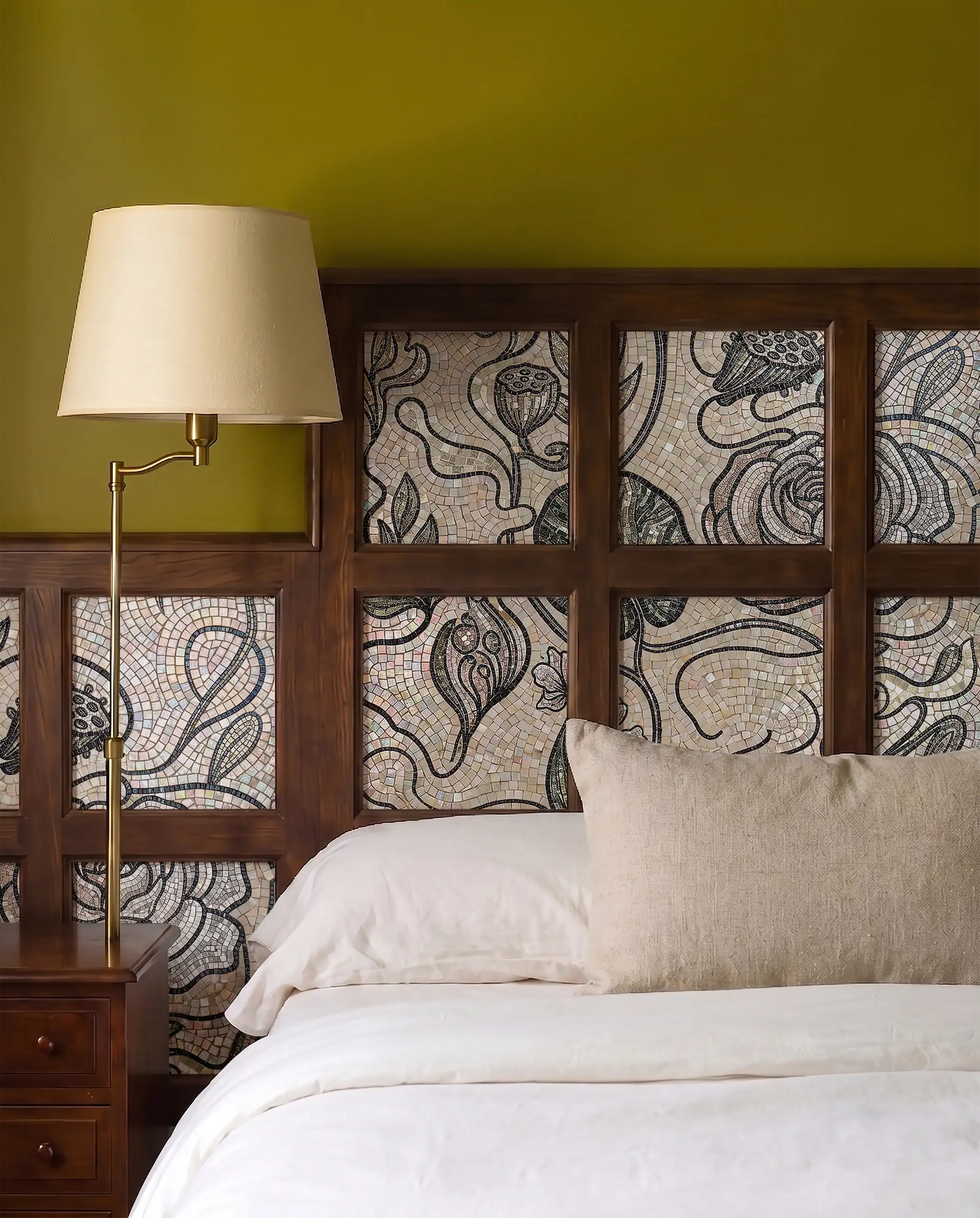 handcrafted botanical mosaic headboard featuring flowing vines, floral motifs, and charcoal stone tesserae framed within wooden panels