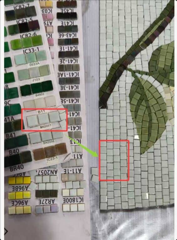 Close-up comparison of a color swatch sheet showing labeled light green tile samples alongside a section of green leaf mosaic tile artwork.