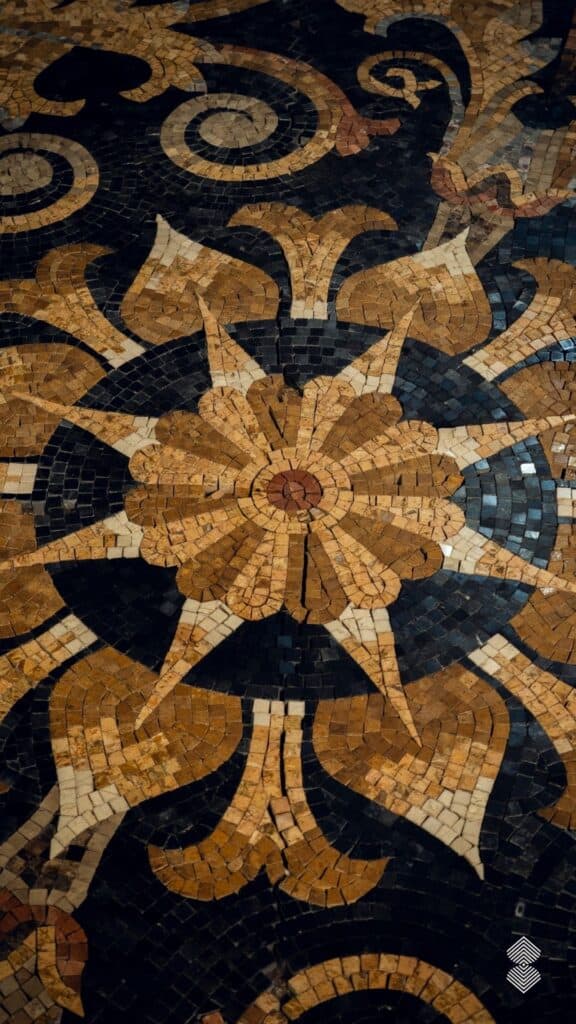 Marble mosaic rugs in black and golden-shaded floral design.
