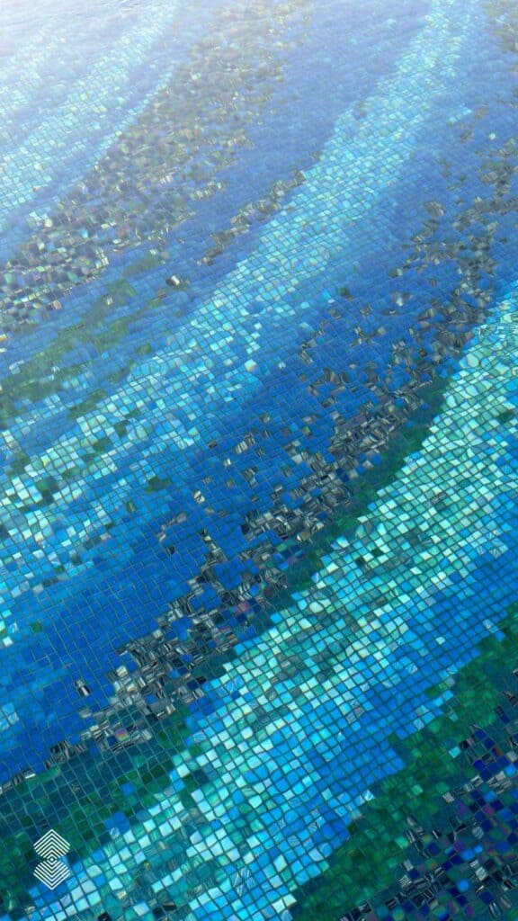 custom glass mosaic pool floor with swirling vortex design