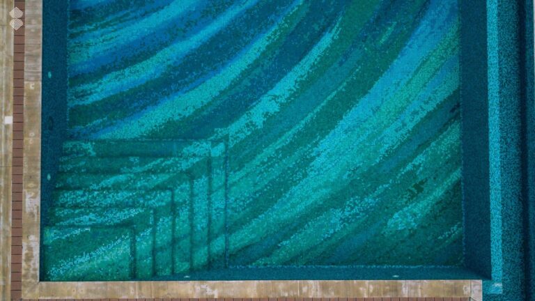 Swirling mosaic pool design viewed from above