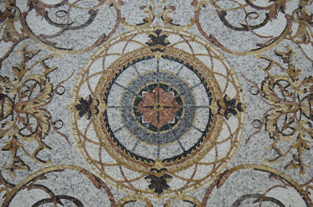 Marble mosaic rugs boasting intricate patterns and a range of colours.
