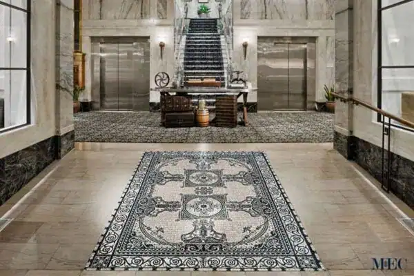 A stunning marble mosaic rug crafted by MEC for a luxury hospitality resort.