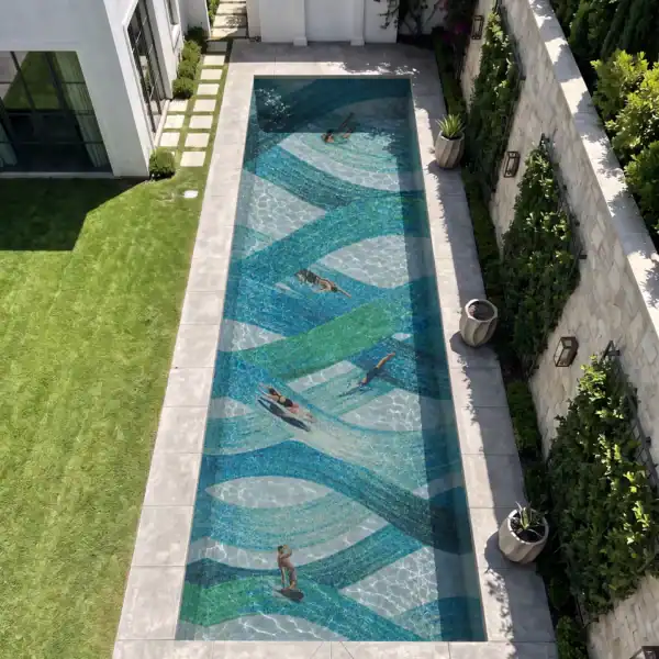 Larimar Sojourn Larimar Sojourn pool mosaic with flowing aqua, turquoise, blue, green and white ribbons creating an abstract ocean-current design underwater.