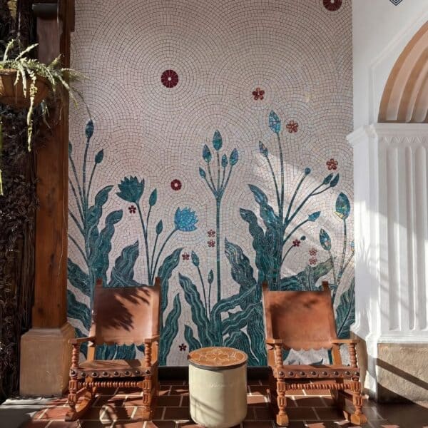 Seraphic Cadance Seraphic Cadence mosaic wall features teal botanical leaves, lotus blooms, tall stems, and burgundy floral accents.