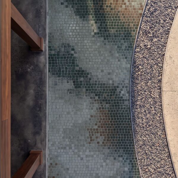 Abstract Shadow Walkway Mosaic Overhead view of a mosaic walkway tile path with a soft gray-green shadow pattern bordered by curved gravel edging.