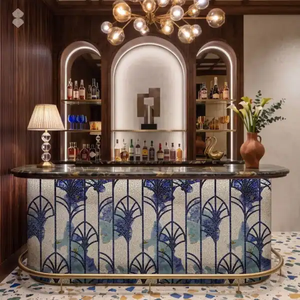 deco-azure Blue Art Deco mosaic bar features repeating fan motifs, geometric lines, and stylized botanical details.