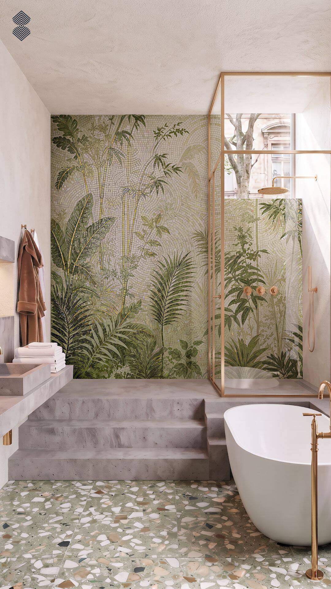 A modern bathroom with terrazzo flooring, a white tub with gold fixtures, and a glass shower area backed by a large-scale green mosaic wall depicting lush tropical jungle foliage.