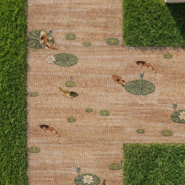Koi Pond Walkway Mosaic Overhead view of a koi pond walkway mosaic set into a garden path with swimming koi and lily pads flanked by lawn.