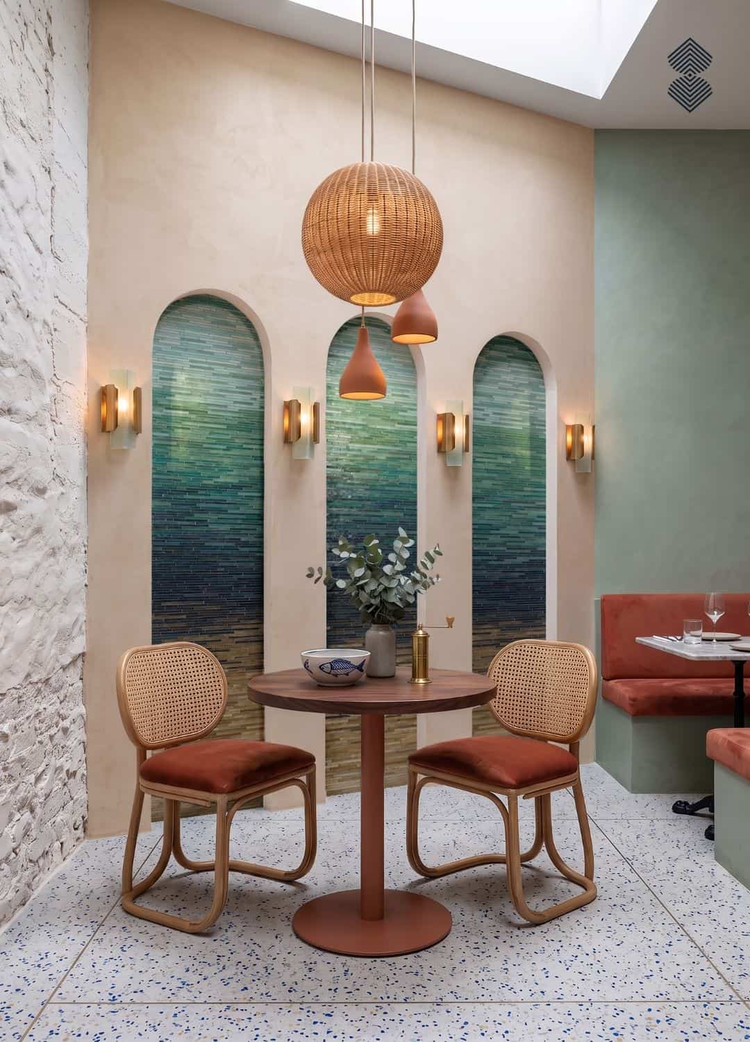 Three arched niches filled with ombre arched mosaic panels shifting from teal to sage green tesserae.