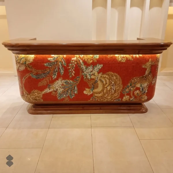 the-cinnabar Cinnabar mosaic counter features stylized deer, wildlife, and botanical branches against a rich red background design.