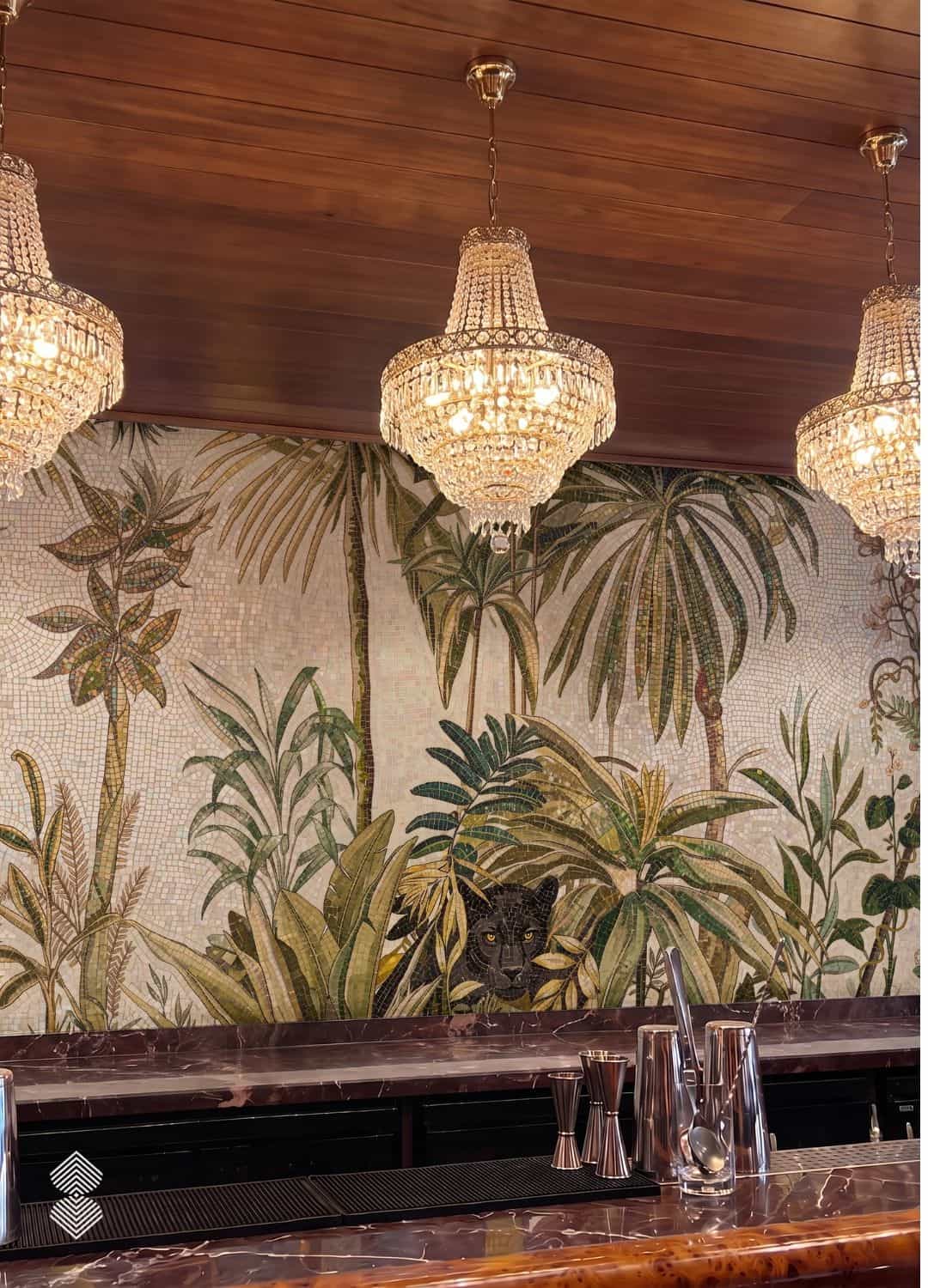 A tropical palm mosaic mural with dense green fronds and a hidden black panther set behind a restaurant bar