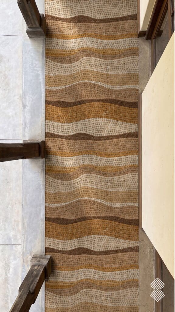 Long wave mosaic walkway design for home entrance