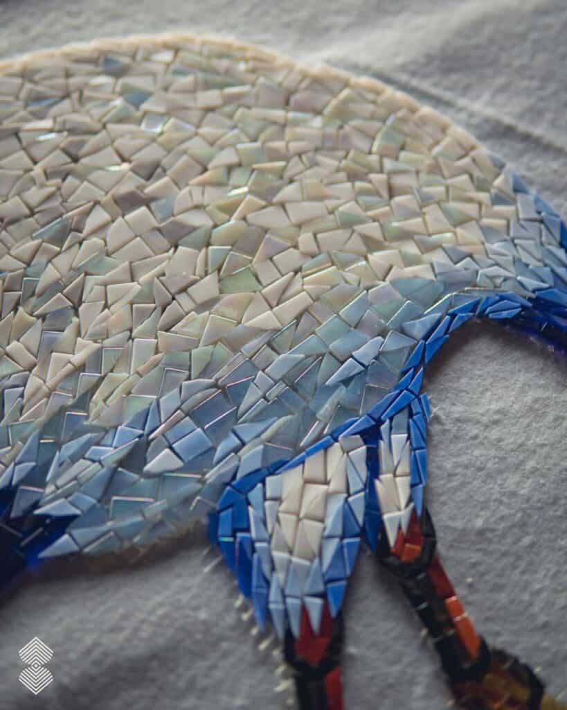 Detailed mosaic mural artwork featuring hand-cut marble and glass tesserae