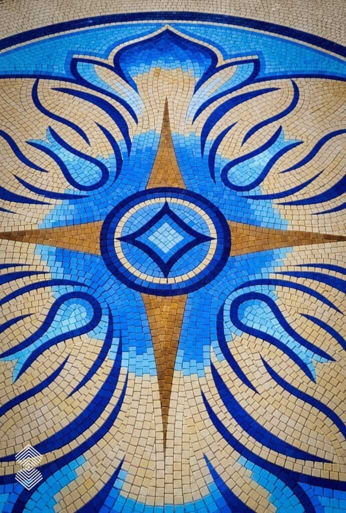 Handcrafted Renaissance mosaic background showcasing classical architectural details, subtle color transitions, and decorative patterns.