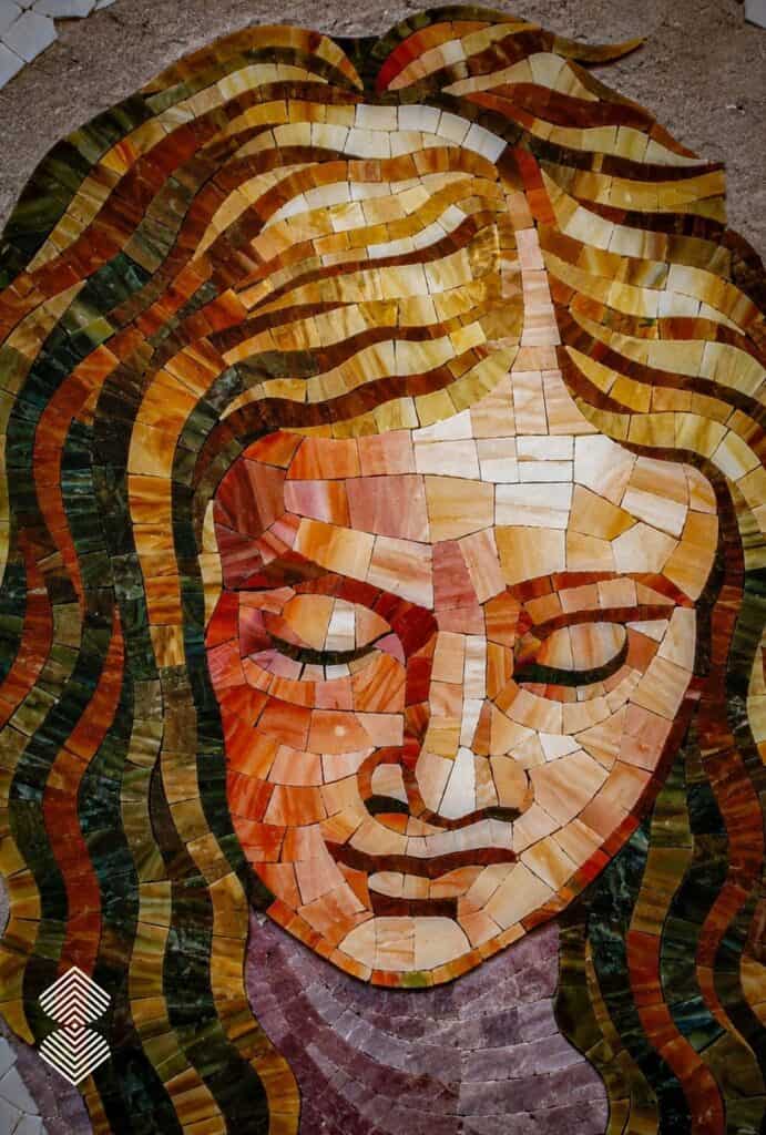 Close-up of Renaissance mosaic portrait showcasing intricate facial details, natural skin tones, and carefully arranged hand-cut tesserae.