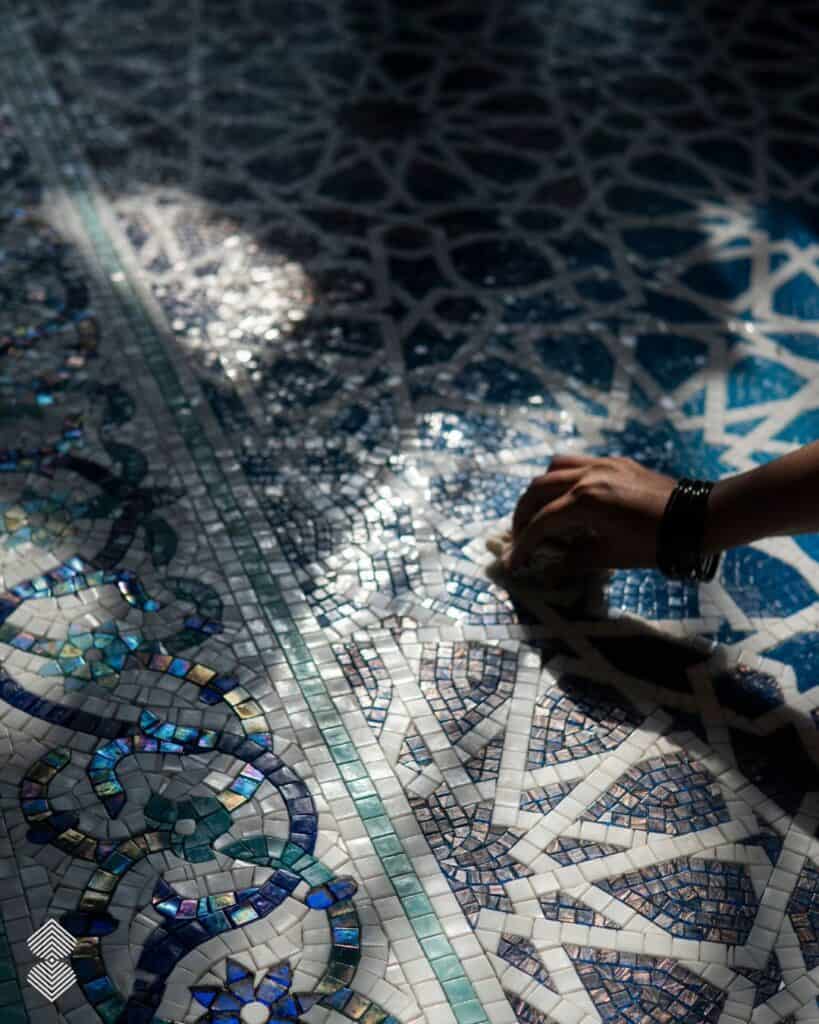 Glass mosaic tile mural with flowing curves and carefully arranged color gradients