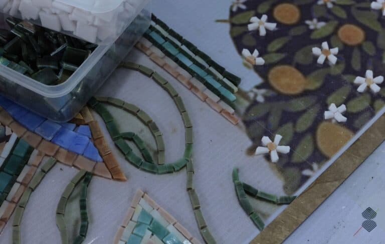 Detailed mosaic craftsmanship highlighting the golden accents