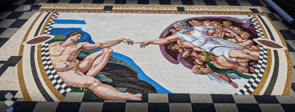 Handcrafted Renaissance mosaic depicting the iconic reaching hands from Michelangelo's Creation of Adam.
