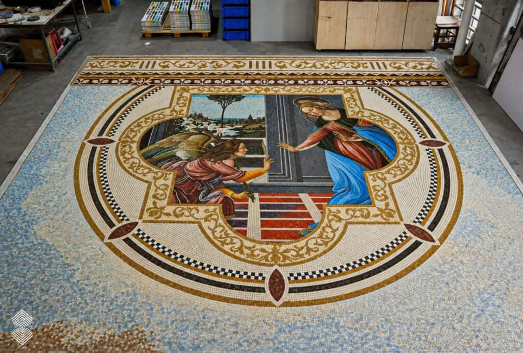Annunciation mosaic featuring angel Gabriel and the Virgin Mary within an ornate Renaissance medallion.