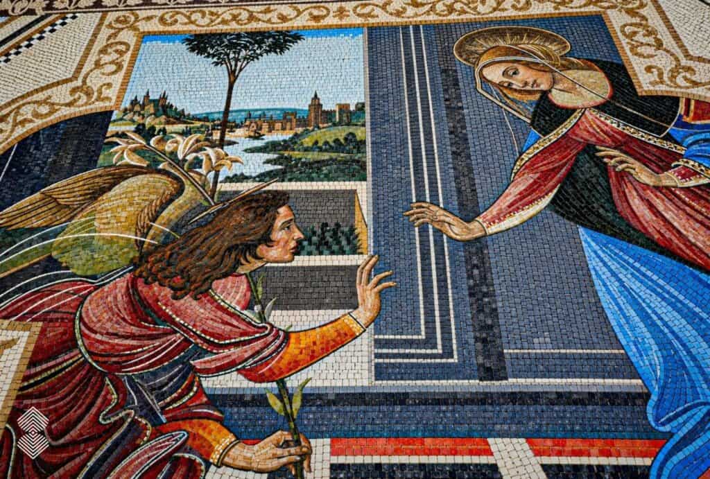 Religious Renaissance mosaic with golden angel wings, blue garments, and decorative floral borders.