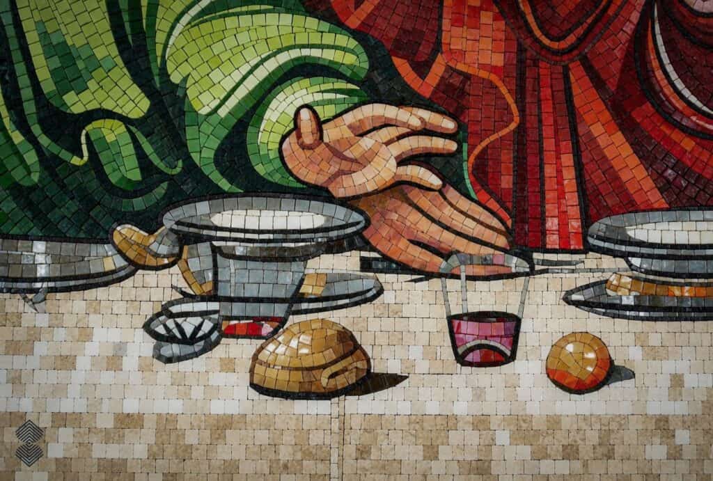 Detailed Last Supper mosaic featuring a cream-colored tablecloth, vibrant clothing, and geometric borders.