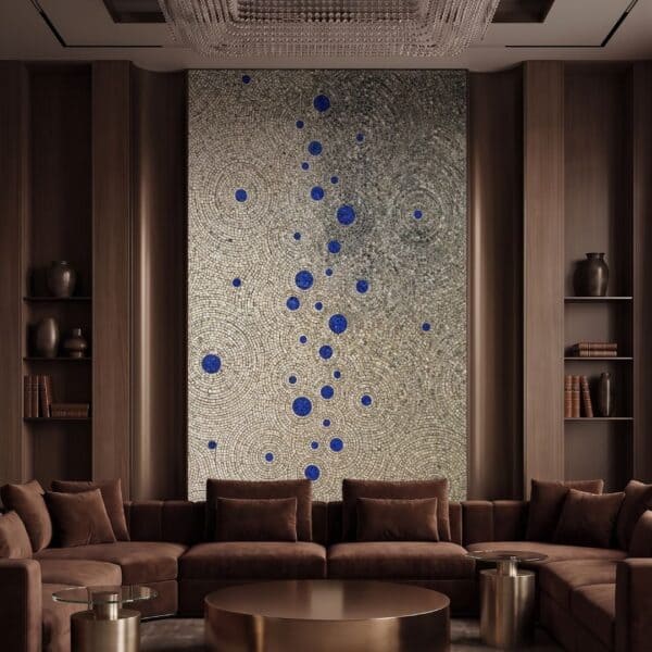 A tall circular mosaic wall art panel with gray and cream concentric rings and a vertical line of cobalt blue spheres