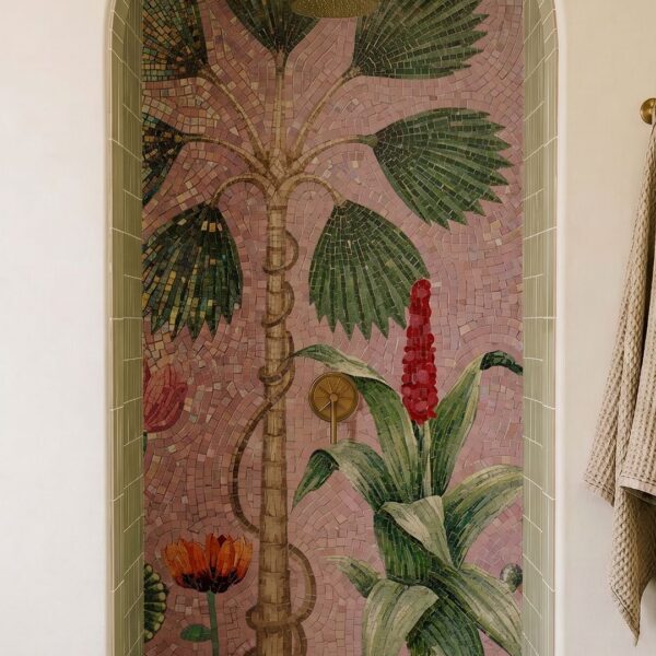 A palm tree mosaic mural with flowering plants set into an arched shower wall niche.