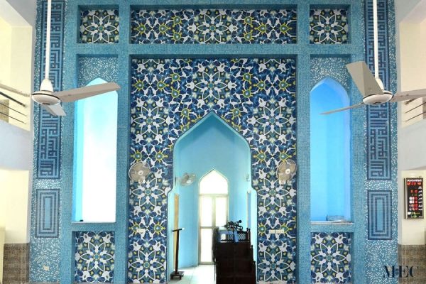 Floral Arabesque and Persian pattern with Kufic Islamic Calligraphy and blue glass mosaic random mixing tiles. Mosque wall cladded Custom handmade ornamental tiles by MEC.