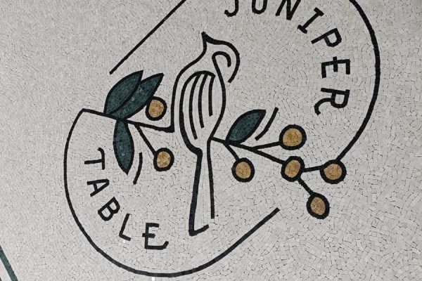 Juniper Table IHG entrance floor mosaic logo completed close-up view