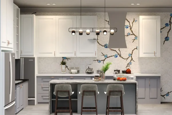 Modern kitchen interior with floral mosaic backsplash, pendant lighting, and white cabinetry above gray island.